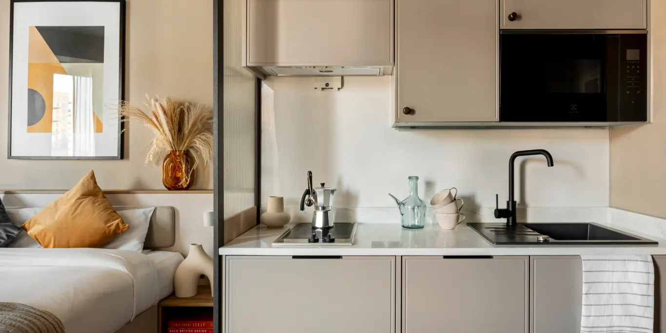 A bedroom with kitchen included
