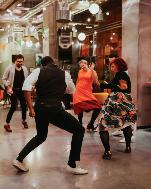 Two men and two women dancing